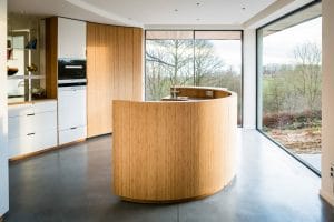 Custom kitchen with curved island - wood, steel and stainless steel