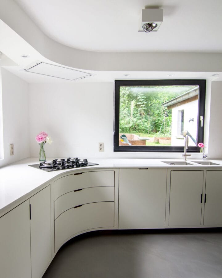 Custom-made kitchen with curved drawers